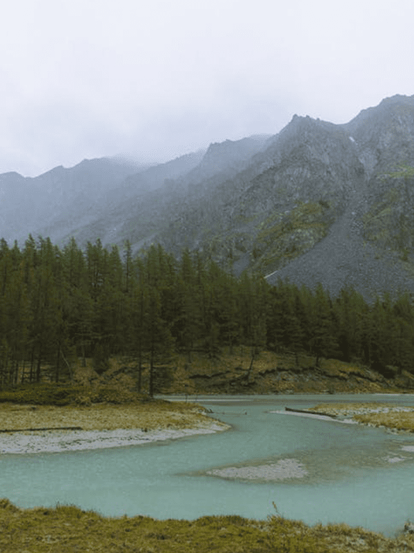 Serene river flowing through mountains.