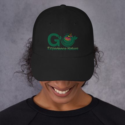 Person wearing a black cap with logo.