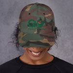 Camouflage baseball cap with "Go Experience Nature" logo.