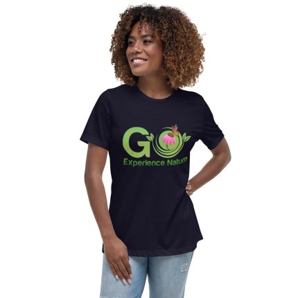 Woman wearing a navy blue t-shirt with a nature logo.