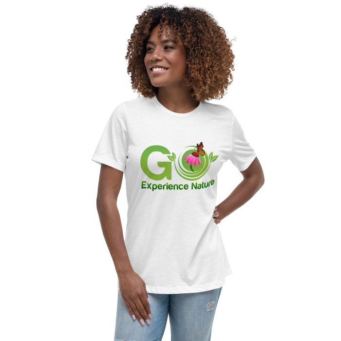 Woman wearing a white t-shirt with a nature logo.