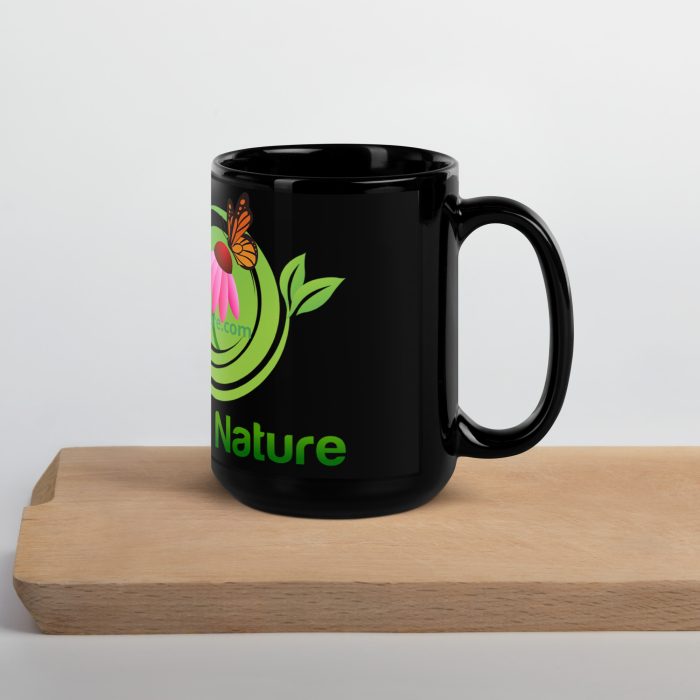 Black mug with butterfly and flower design.