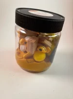 Yellow slime with bee figurines in jar.